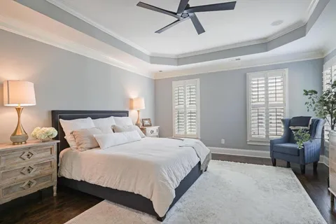 a bedroom with a bed and furniture