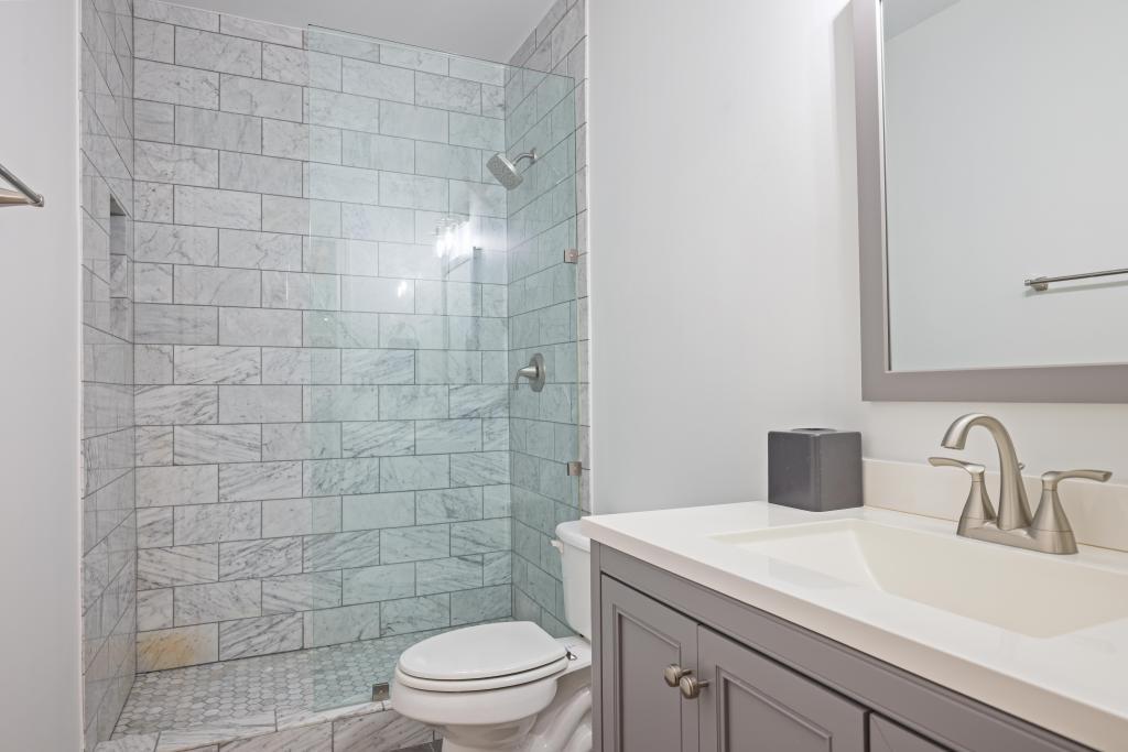 3601 Habersham Road Northwest Atlanta, GA 30305 - Photo 29 of 34 a bathroom with a sink a toilet and shower