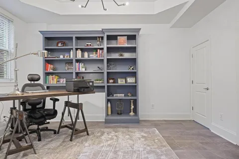 a view of a workspace with furniture
