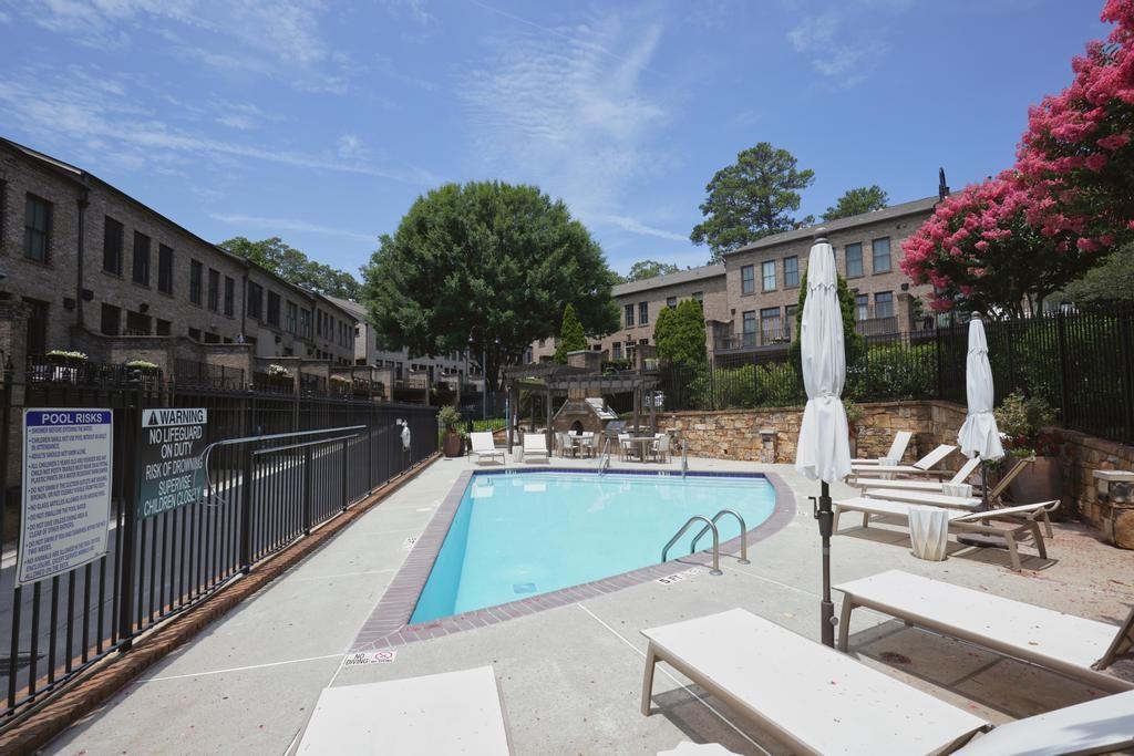 3601 Habersham Road Northwest Atlanta, GA 30305 - Photo 34 of 34 a view of a swimming pool with chairs