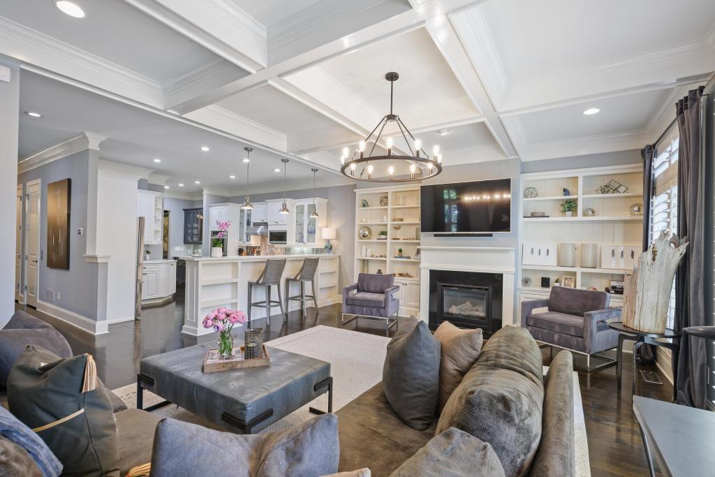 3601 Habersham Road Northwest Atlanta, GA 30305 - Photo 7 of 34 a living room with fireplace furniture and a chandelier