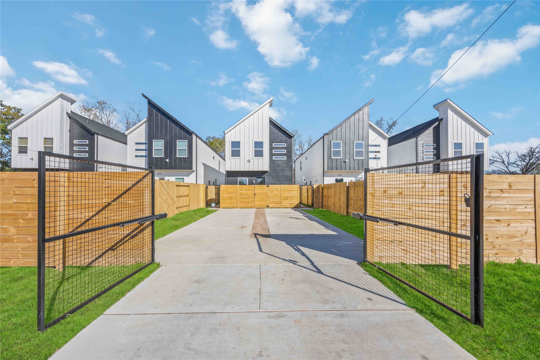 a view of a house with wooden fence