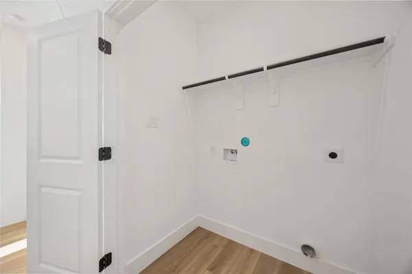 a view of a door house with a tub