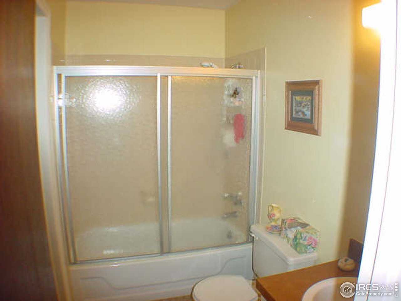 6626 Kalua Road Boulder, CO 80301 - Photo 3 of 15 a bathroom with a shower and a toilet
