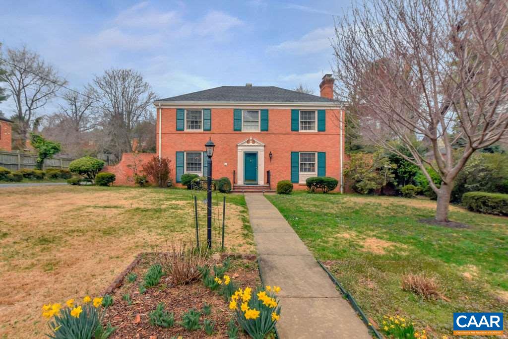103 Surrey Road Charlottesville, VA 22901 - Photo 1 of 28 a front view of a house with a yard and fountain