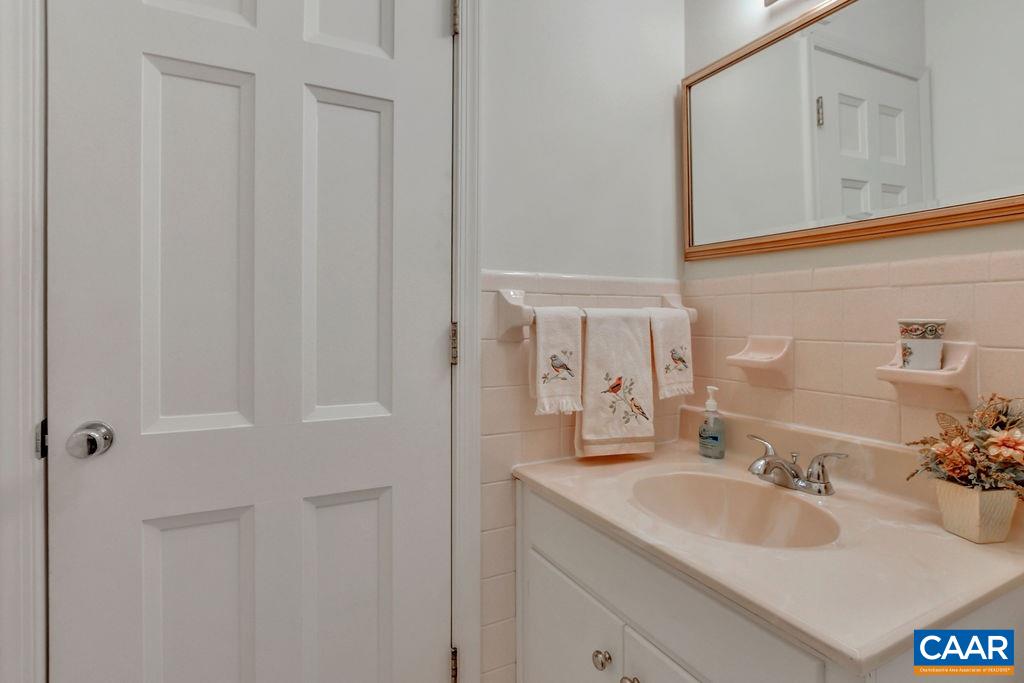 103 Surrey Road Charlottesville, VA 22901 - Photo 11 of 28 a bathroom with a sink and a mirror