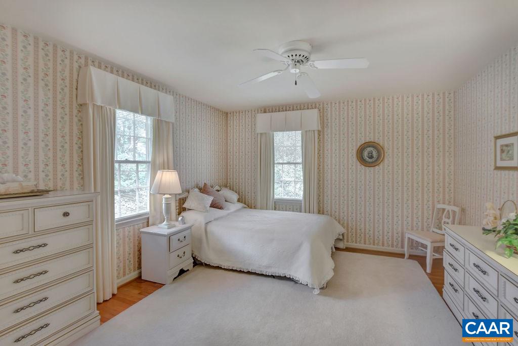 103 Surrey Road Charlottesville, VA 22901 - Photo 17 of 28 a bedroom with a bed and a dresser