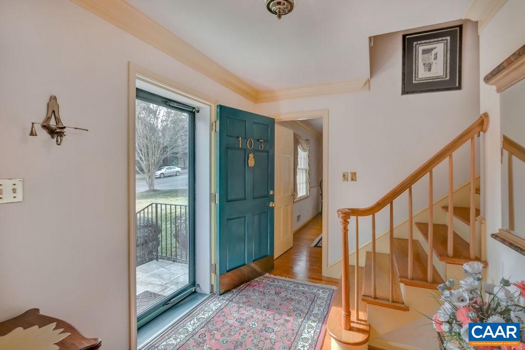 103 Surrey Road Charlottesville, VA 22901 - Photo 4 of 28 a view of an entryway with wooden floor and a livingroom