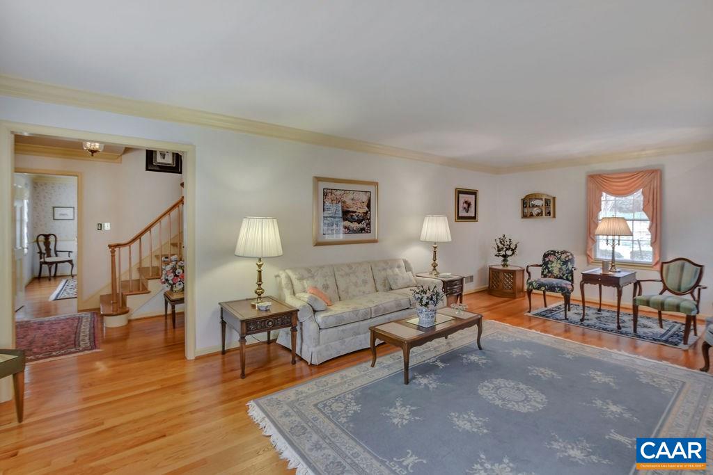 103 Surrey Road Charlottesville, VA 22901 - Photo 6 of 28 a living room with furniture and wooden floor