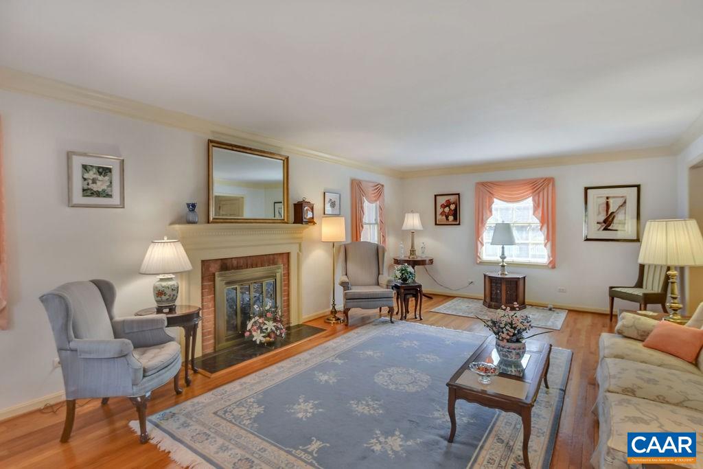 103 Surrey Road Charlottesville, VA 22901 - Photo 7 of 28 a living room with furniture and a fireplace