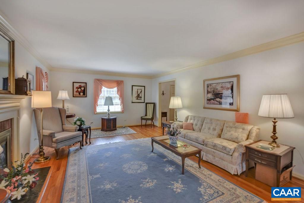 103 Surrey Road Charlottesville, VA 22901 - Photo 8 of 28 a living room with furniture and a wooden floor