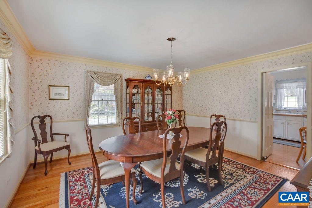103 Surrey Road Charlottesville, VA 22901 - Photo 9 of 28 a view of a dining room with furniture and chandelier