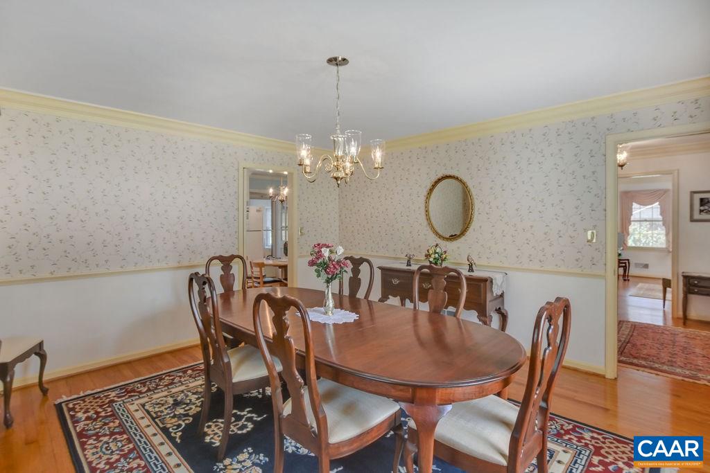 103 Surrey Road Charlottesville, VA 22901 - Photo 10 of 28 a view of a dining room with furniture and wooden floor