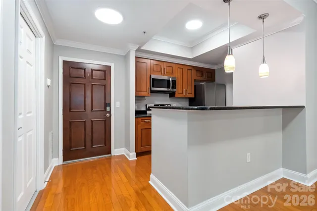 a kitchen with a refrigerator and a microwave