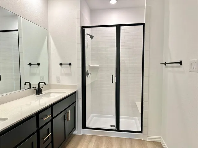 a bathroom with a double vanity sink mirror and double