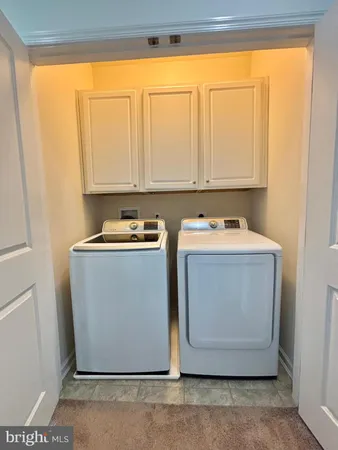 a utility room with washer and dryer