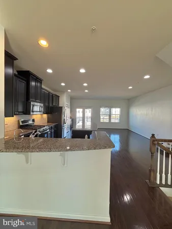 a view of a kitchen with a sink