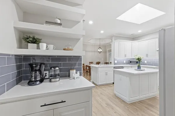 a kitchen with a sink and cabinets