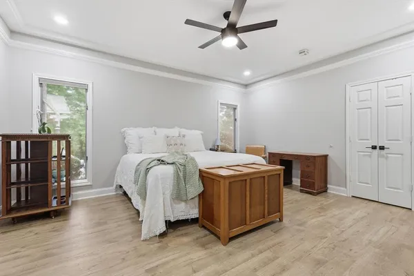 a bed room with a bed and a book shelf