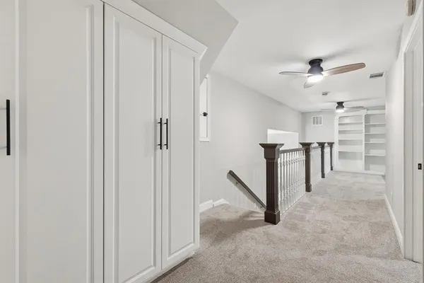 a view of a hallway with closet