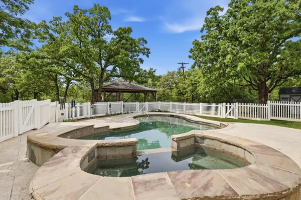 a view of a swimming pool with a patio