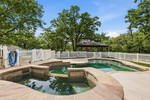 a view of a swimming pool with a patio