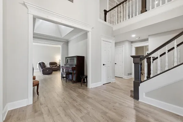 a view of a livingroom with hardwood floor and workspace