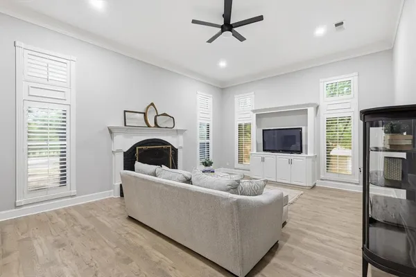 a living room with furniture and a fireplace