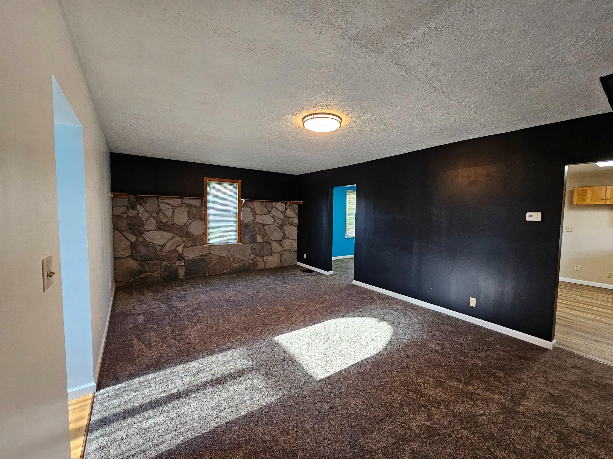 1967 Hyndman Road Hyndman, PA 15545 - Photo 26 of 41 Spacious living room with unique stone accent.