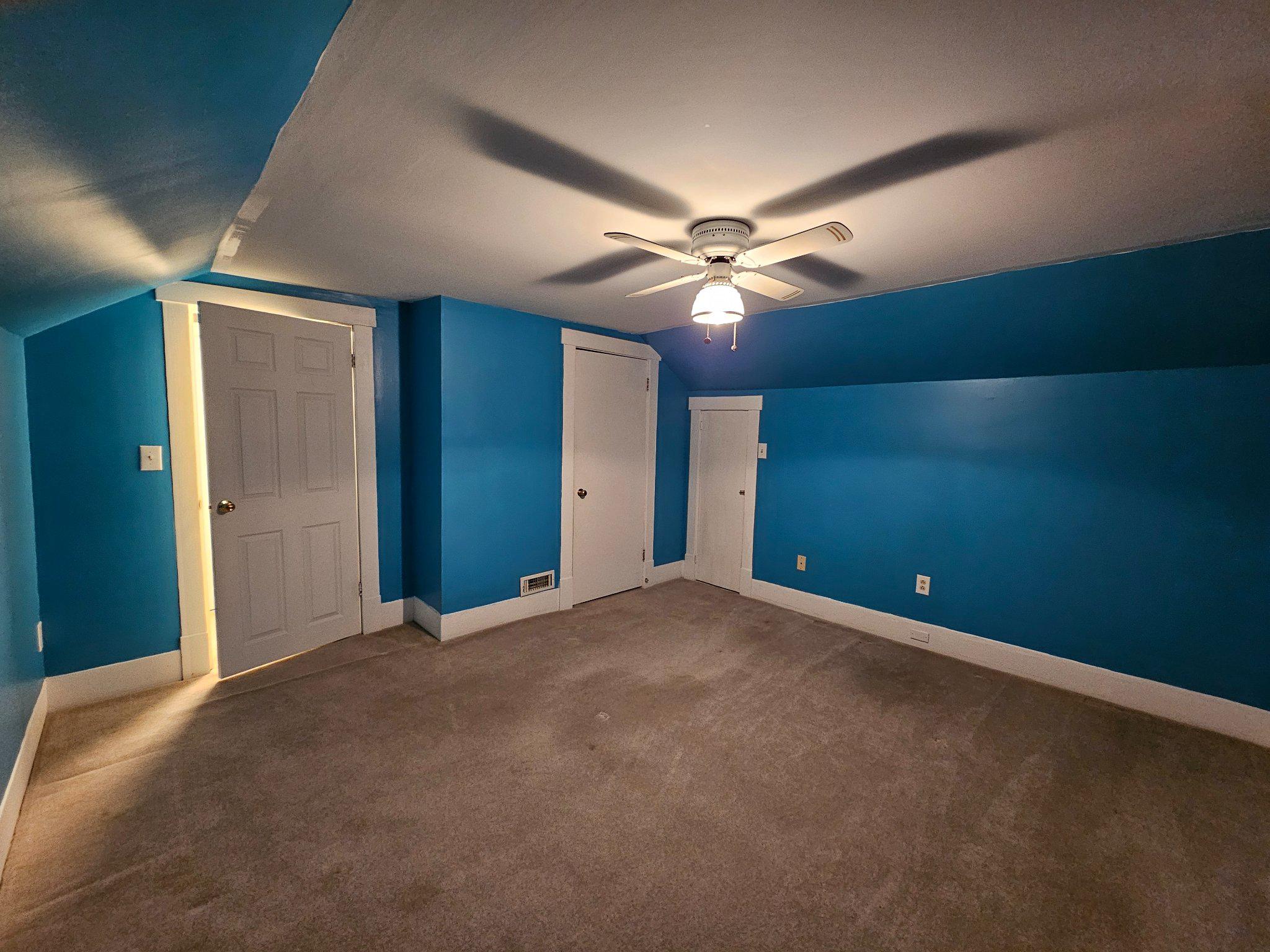 1967 Hyndman Road Hyndman, PA 15545 - Photo 27 of 41 Vibrant blue bedroom with cozy charm.