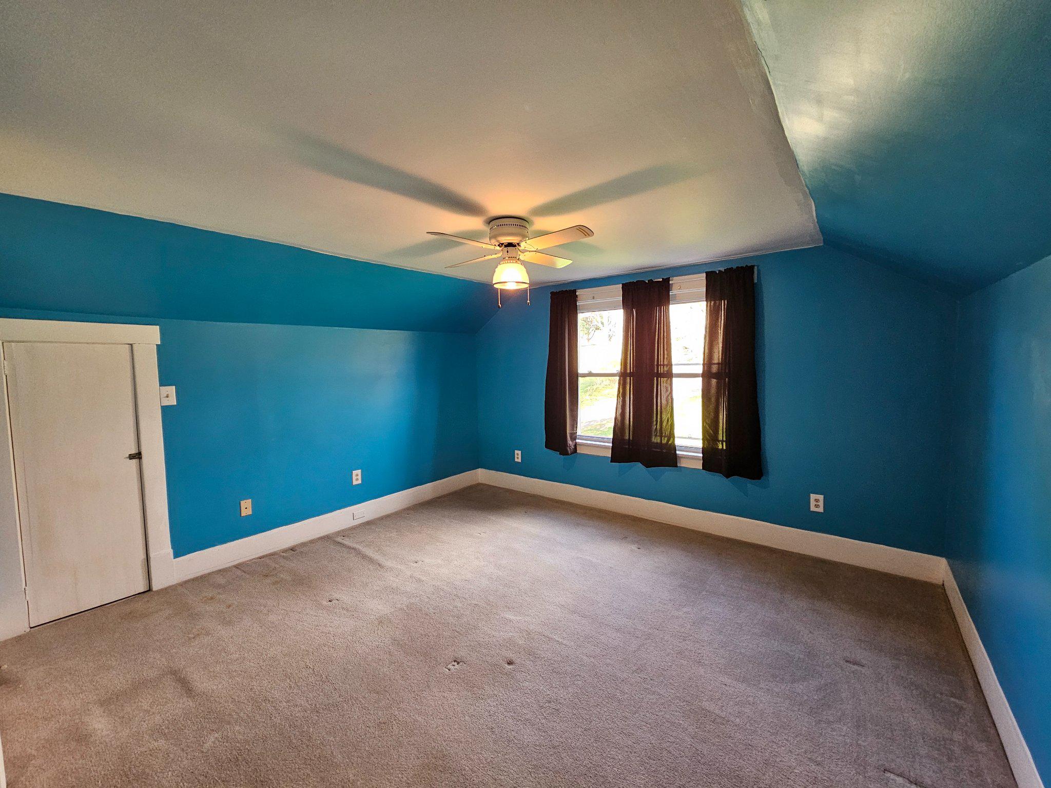 1967 Hyndman Road Hyndman, PA 15545 - Photo 29 of 41 Vibrant blue bedroom with cozy charm.