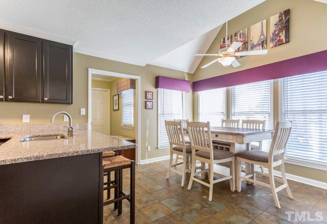 4316 Birmingham Way Raleigh, NC 27604 - Photo 12 of 25 a view of a dining room with furniture and a window