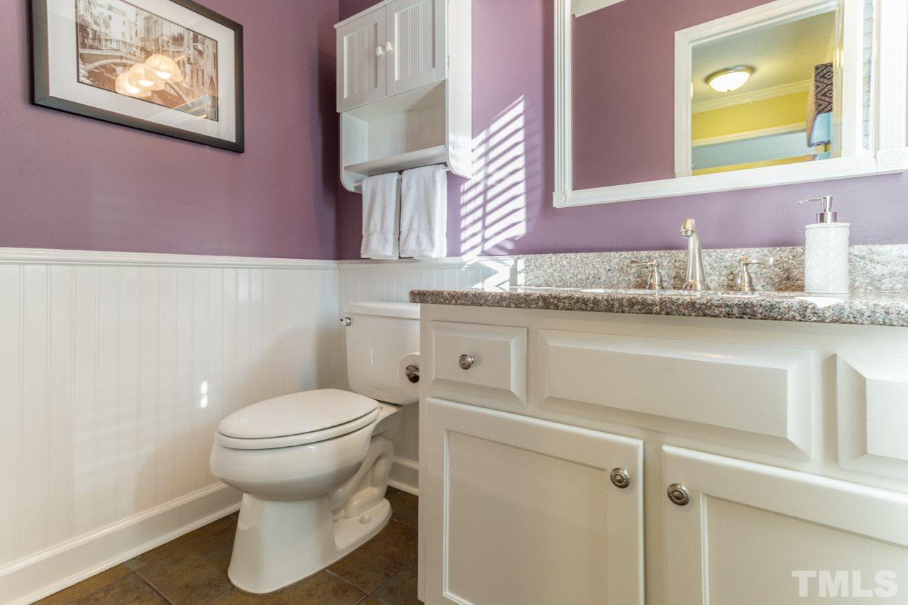 4316 Birmingham Way Raleigh, NC 27604 - Photo 13 of 25 a bathroom with a granite countertop toilet sink and mirror