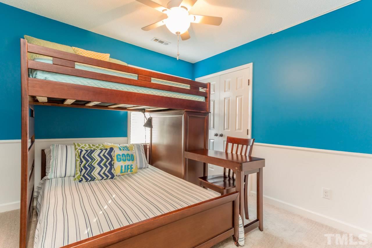 4316 Birmingham Way Raleigh, NC 27604 - Photo 17 of 25 a bedroom with a bed and a window