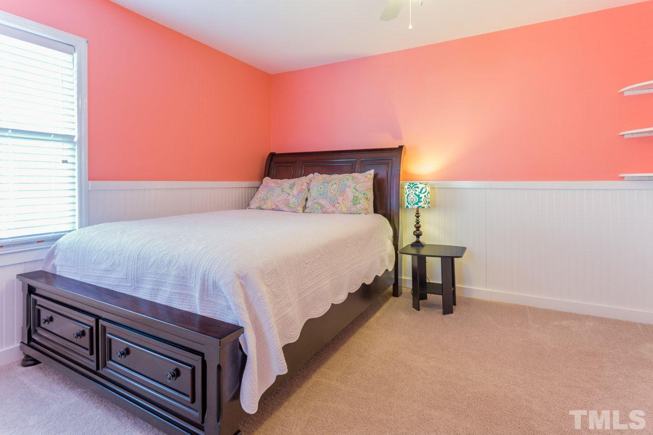 4316 Birmingham Way Raleigh, NC 27604 - Photo 18 of 25 a bedroom with a bed and a night stand
