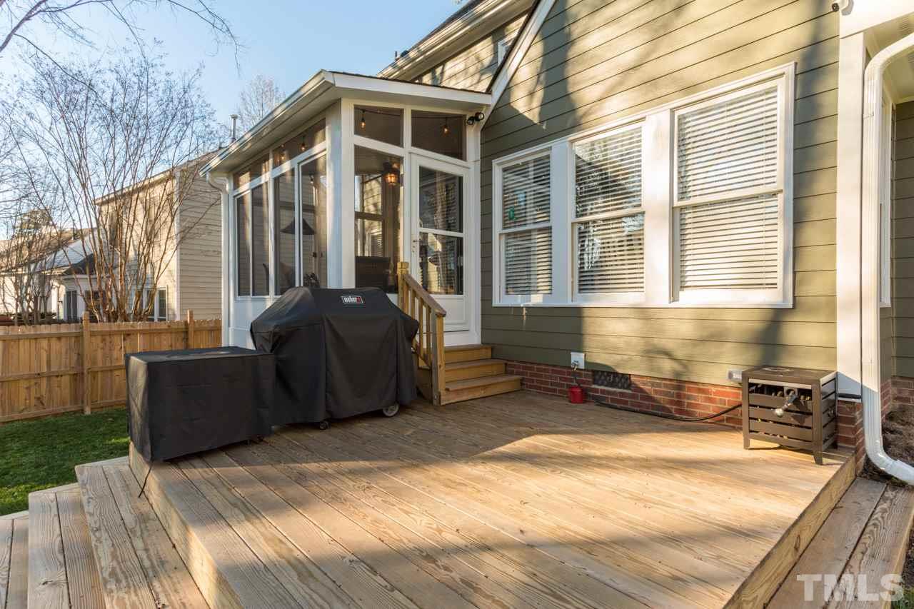 4316 Birmingham Way Raleigh, NC 27604 - Photo 22 of 25 a front view of a house with a yard and furniture