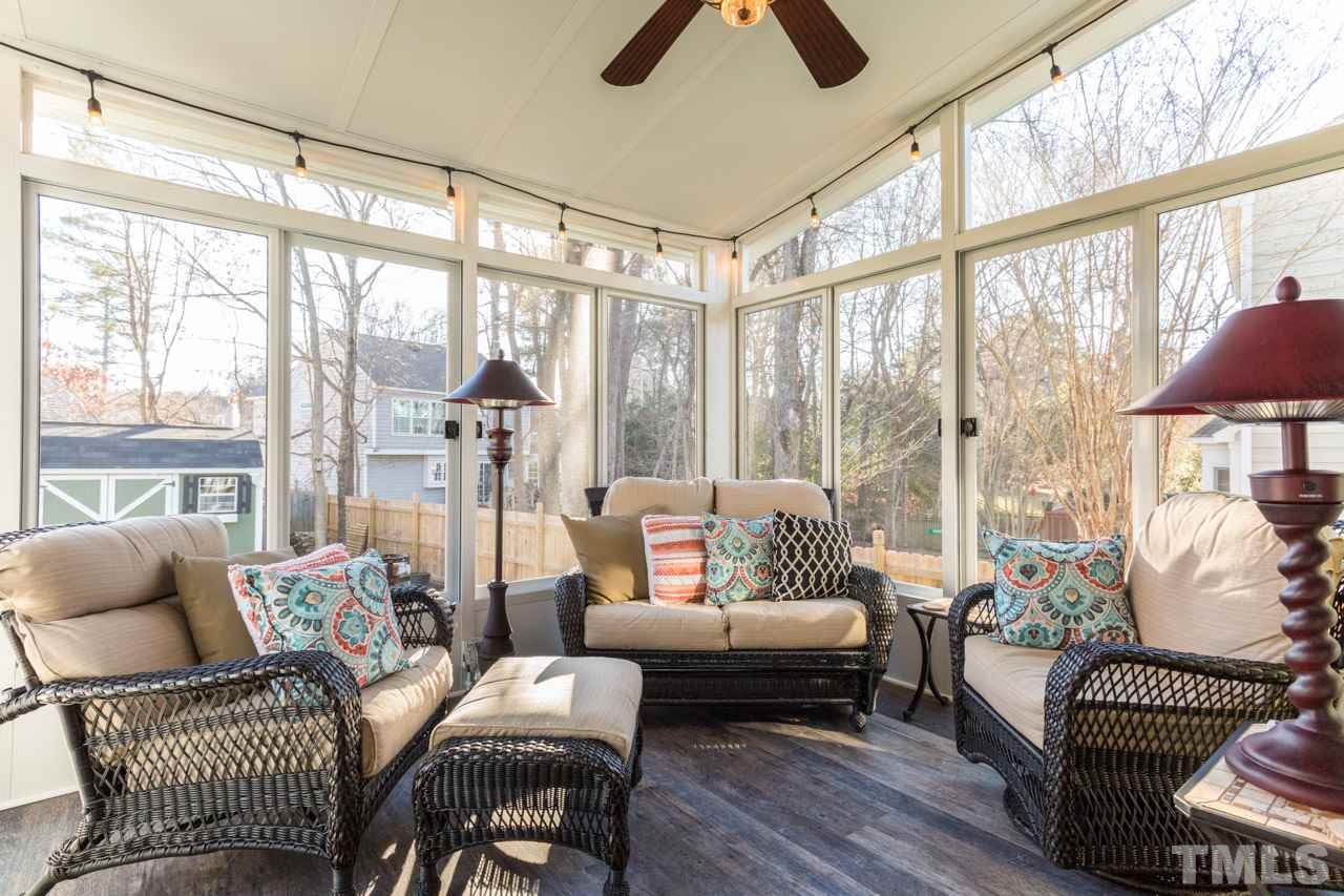 4316 Birmingham Way Raleigh, NC 27604 - Photo 23 of 25 a living room with furniture and a floor to ceiling window
