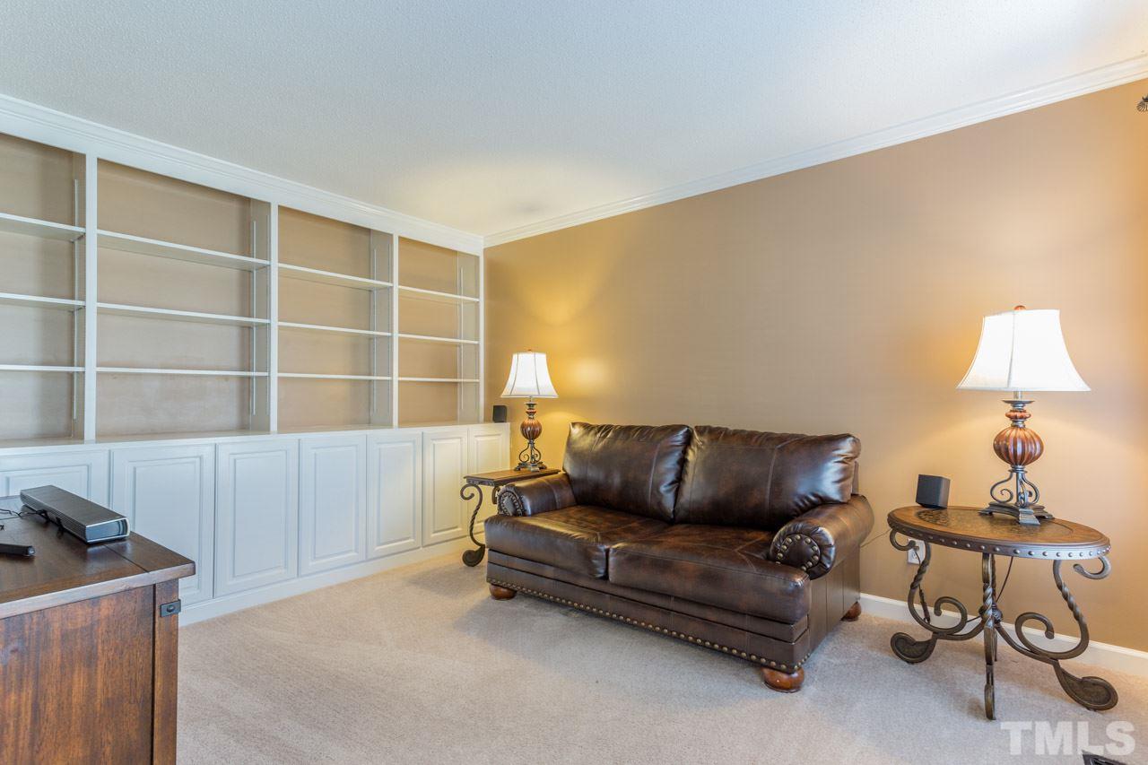 4316 Birmingham Way Raleigh, NC 27604 - Photo 6 of 25 a living room with furniture and a lamp