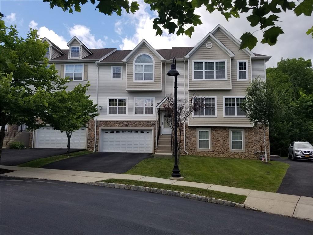 34 Peter Turner Road Monroe, NY 10950 - Photo 1 of 1 a front view of a house with a garden and trees