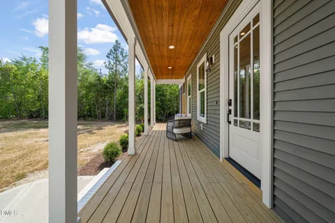 a view of a balcony with wooden floor