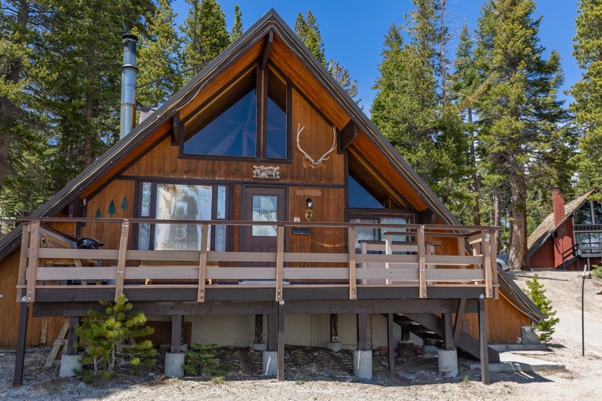 11000 Minaret Road, Unit 2 Mammoth Lakes, CA 93546 - Photo 5 of 31 a backyard of a house with wooden deck and seating space