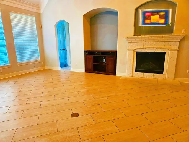 a view of an empty room with a fireplace