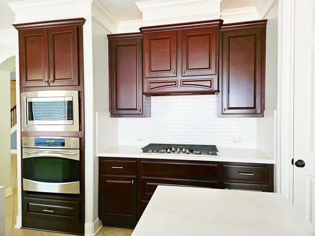 a kitchen with a stove and a refrigerator