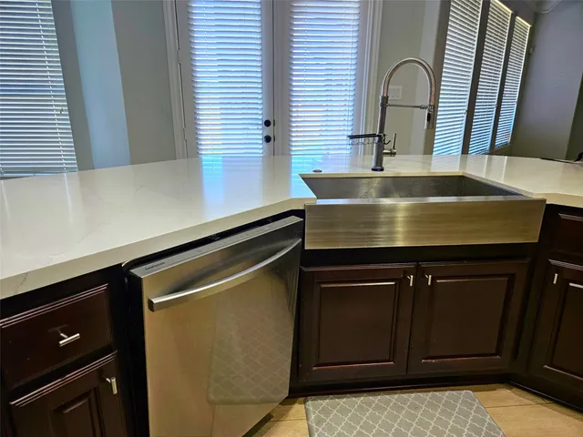 a kitchen with a sink and cabinets