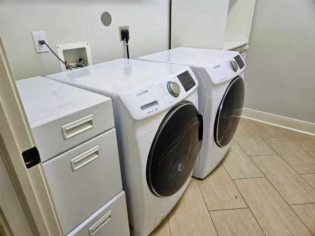 a utility room with dryer and washer
