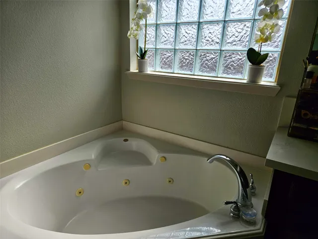 a view of a tub in a bathroom