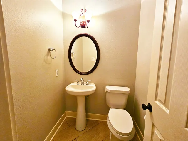 a bathroom with a toilet and a sink
