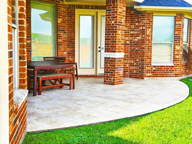 a backyard of a house with outdoor seating