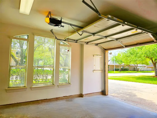 a view of a room with wooden floor and windows