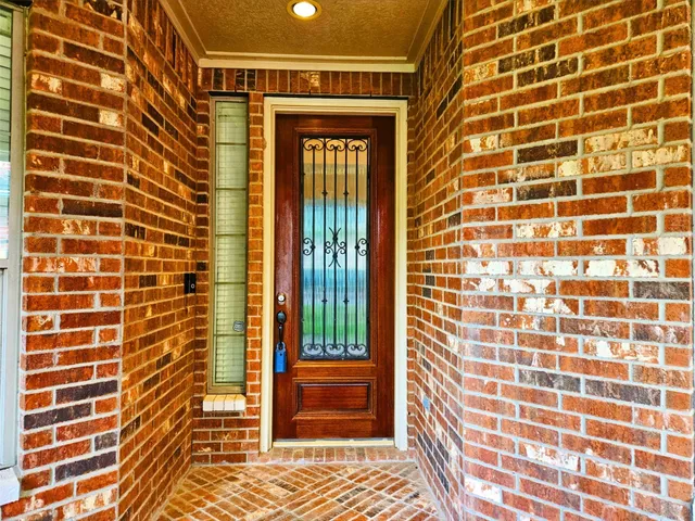 a view of a brick house with a door